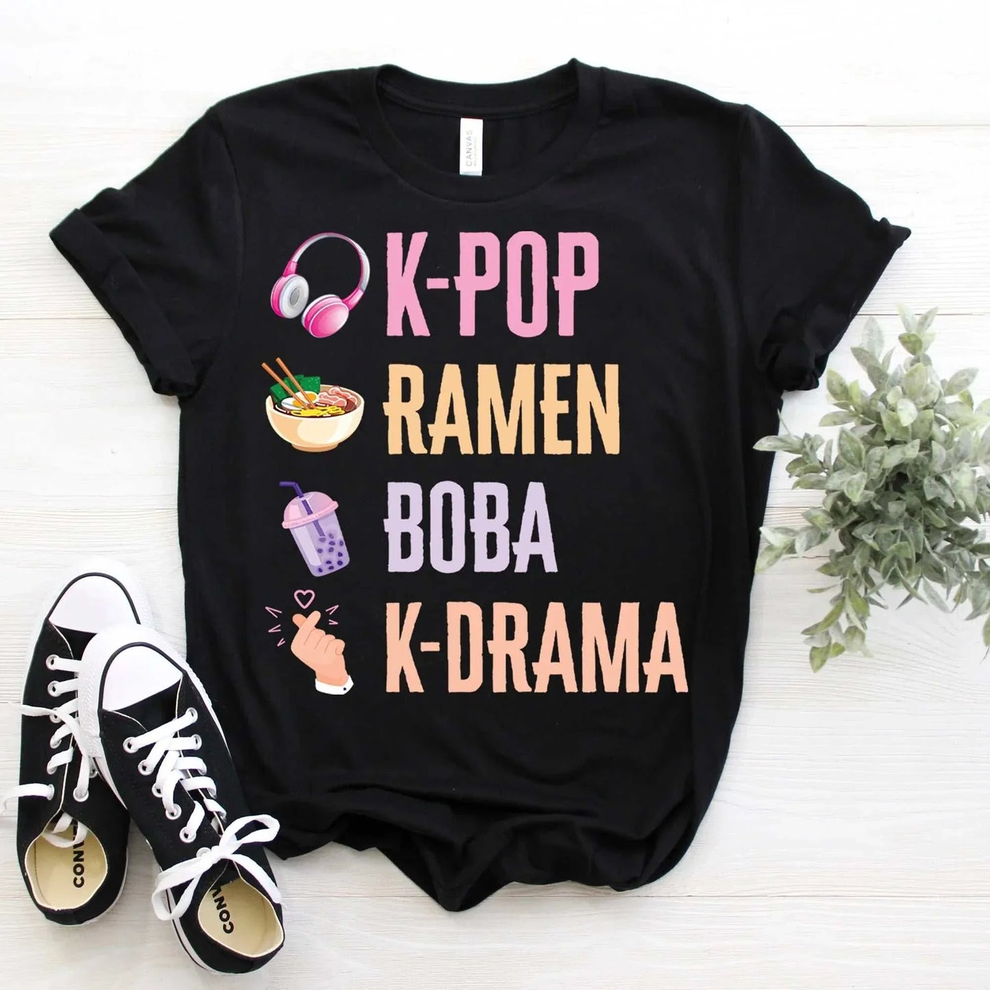 K-Pop South Korea music Kdrama lover t-shirt with pastel designs, featuring icons of headphones, ramen, boba, and finger heart.