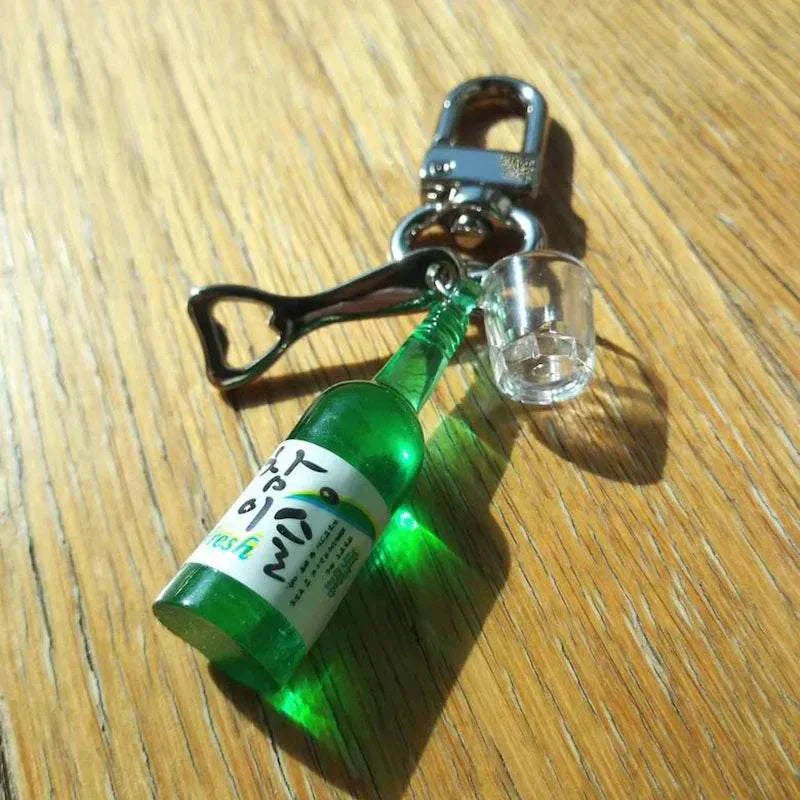 Soju shot glass bottle opener keychain with resin bottle and mini shot glass.